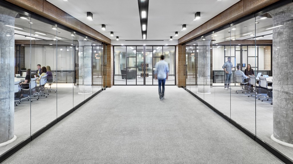 A group of people walking through a building.